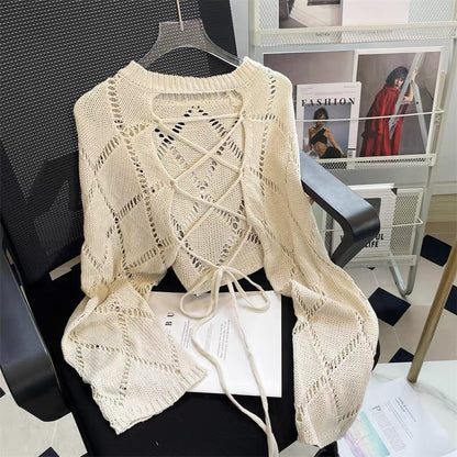 Autumn new design niche lace-up hollow knitted blouse women's loose long-sleeved shawl sweet and spicy top