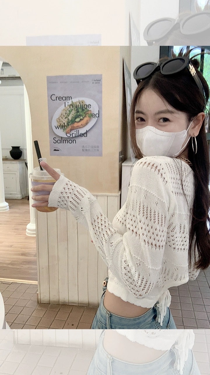 Zeng Xiaoxian cartoon printed hollow knitted sweater women's thin section air-conditioning blouse design sense niche short long-sleeved top