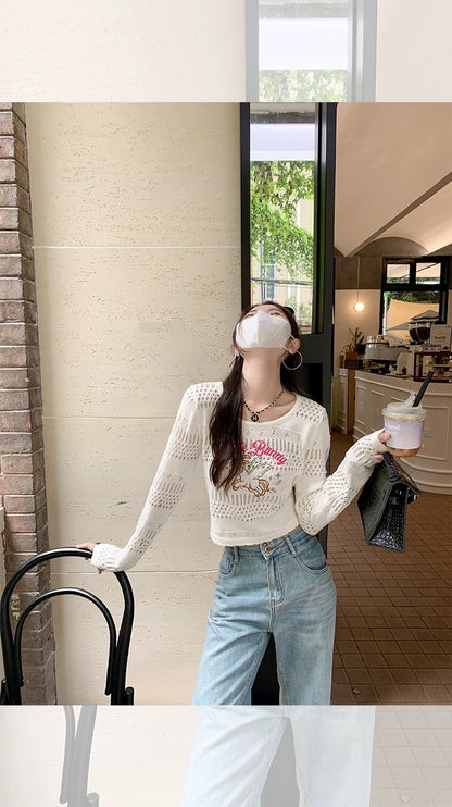 Zeng Xiaoxian cartoon printed hollow knitted sweater women's thin section air-conditioning blouse design sense niche short long-sleeved top