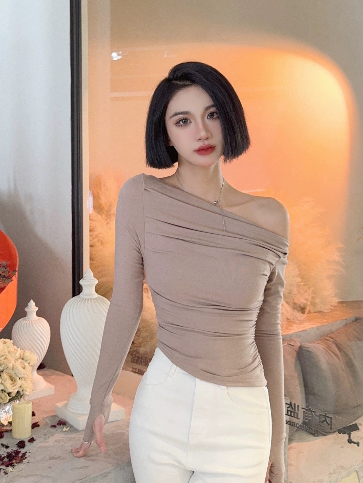 Light fabric tone early autumn new European and American solid color asymmetrical one-line collar off-shoulder pleated waist short long-sleeved T-top